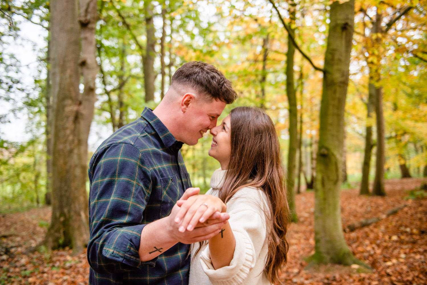 engaged couple nose to nose in the woods at attingham park shrewsbury with Victoria La Bouchardiere