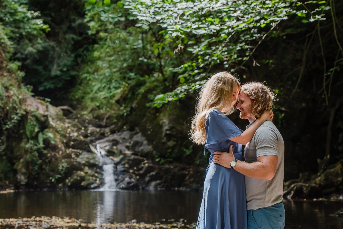 engaged couple near waterfall in Shropshire taken on pre-wedding shoot with Victoria La Bouchardiere