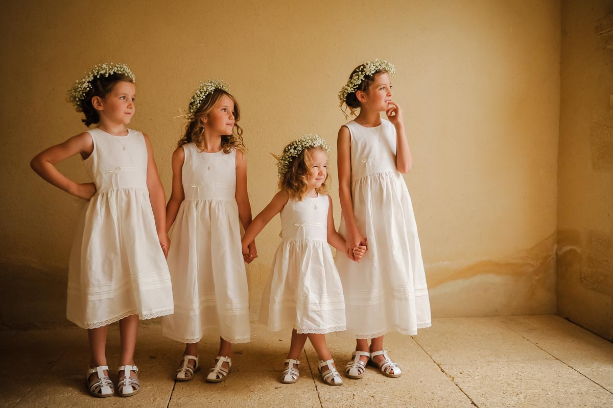 bridesmaids waiting for the bride in white dresses at French wedding