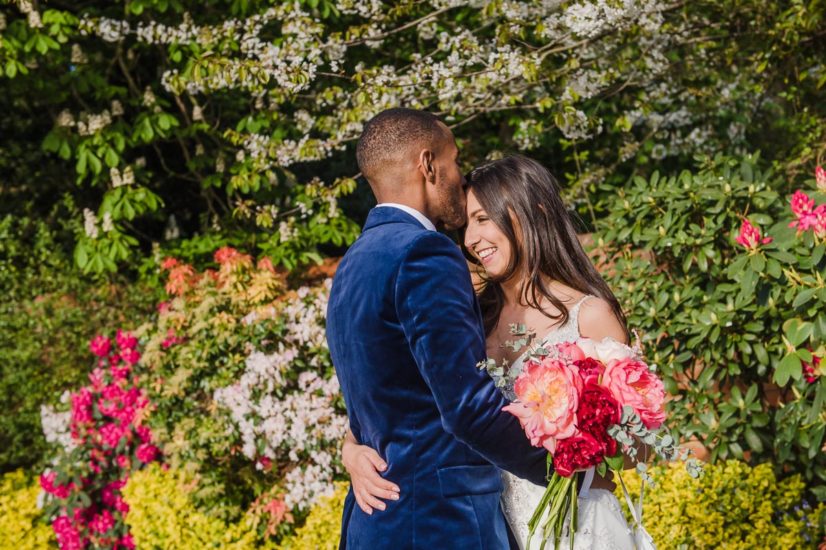 bride and groom in flower garden at wedding in Shrewsbury