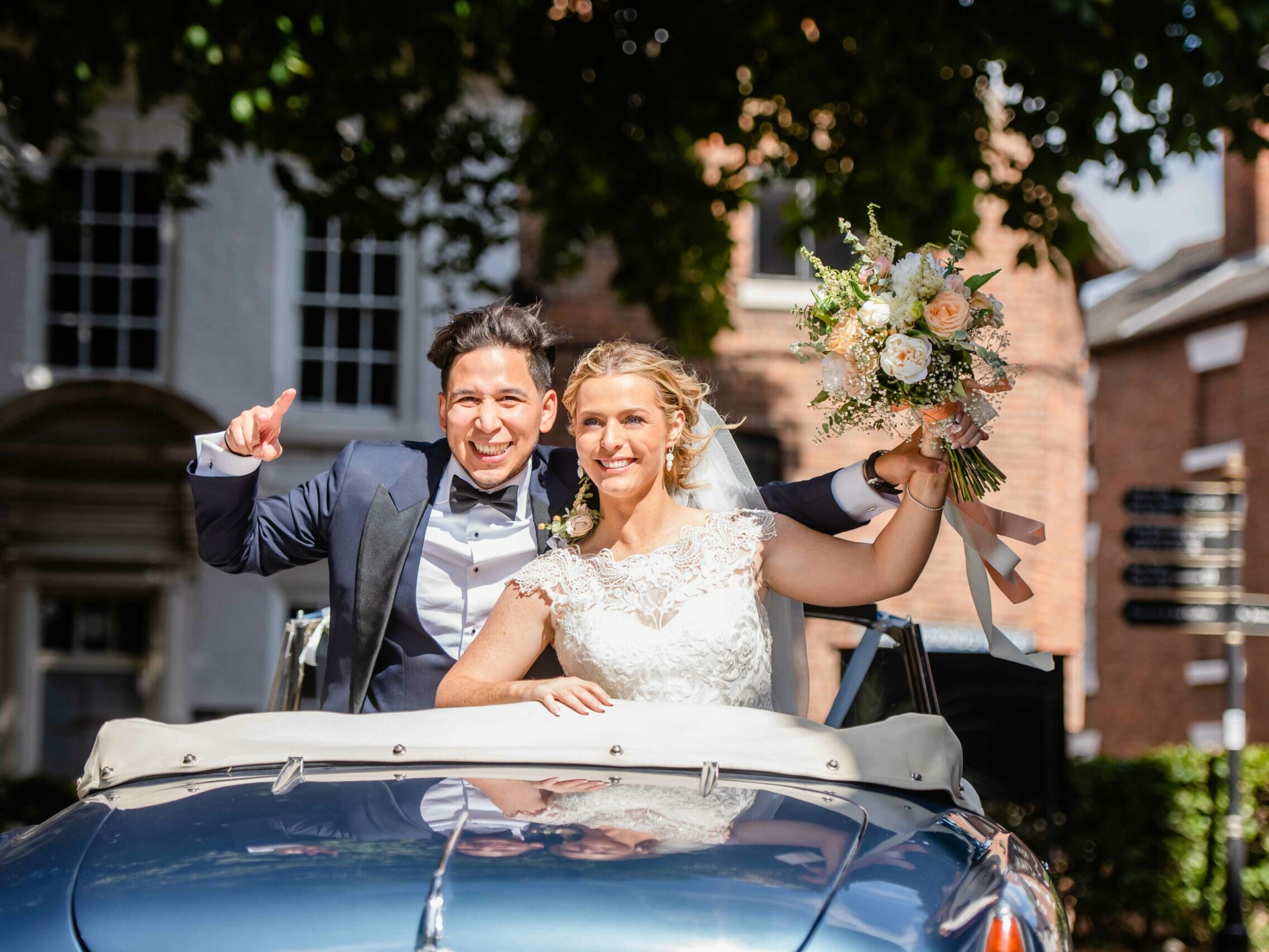 Shrewsbury Wedding couple in car smiling taken by Victoria La Bouchardiere