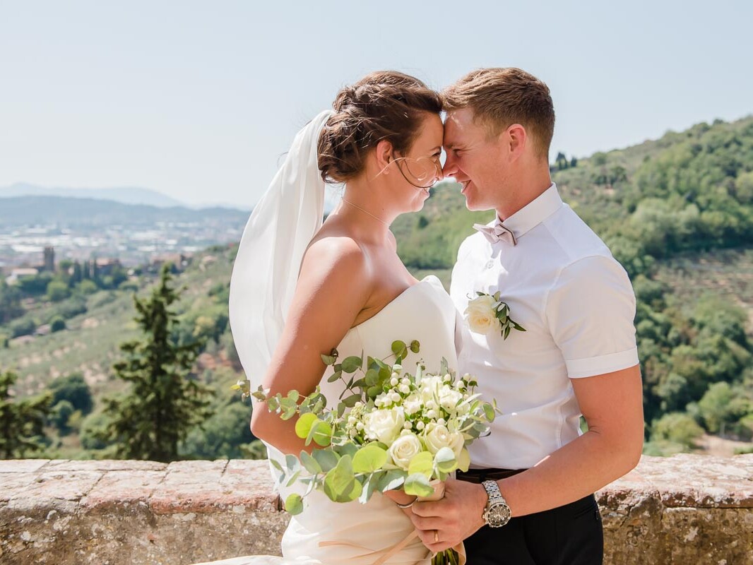 Couple in Tuscany Italy overlooking landscape at Wedding taken by Victoria La Bouchardiere