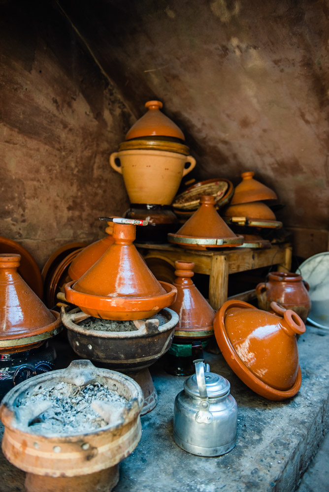 Tagine cooking pots piled in a corner in The Atlas Mountains Morocco